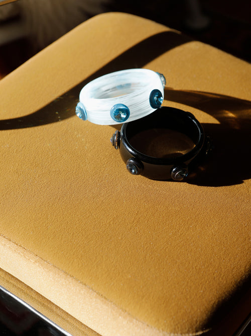 Side view of the MOUNSER Ambrosia Bangle displaying its curved sculptural silhouette and glossy finish.