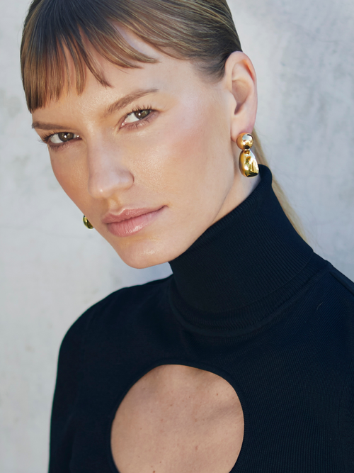 model shot of MOUNSER Aalto Drop Earrings Gold free form drop earrings with removable charms