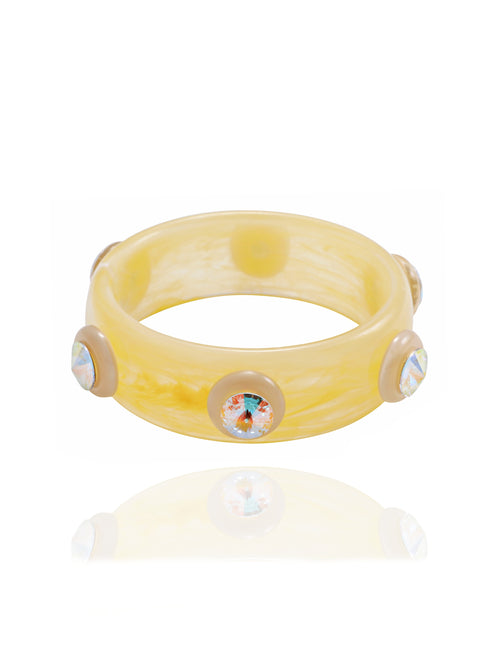 MOUNSER Ambrosia Bangle in Banana Cream featuring a glossy resin silhouette with round Austrian crystal accents.