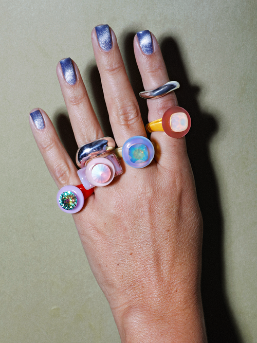 Model shot of MOUNSER Ambrosia Ring in Cherries Jubilee worn on hand showing sculptural resin band and crystal center stone