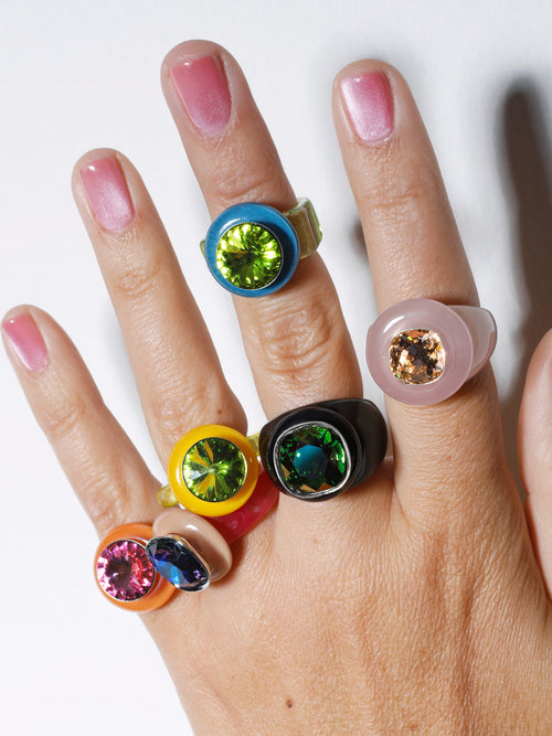 Close up of MOUNSER Bliss Ring in Blush a delicate and minimal acrylic cocktail ring in a jewel toned palette with a Swarovski crystal gemstone.  