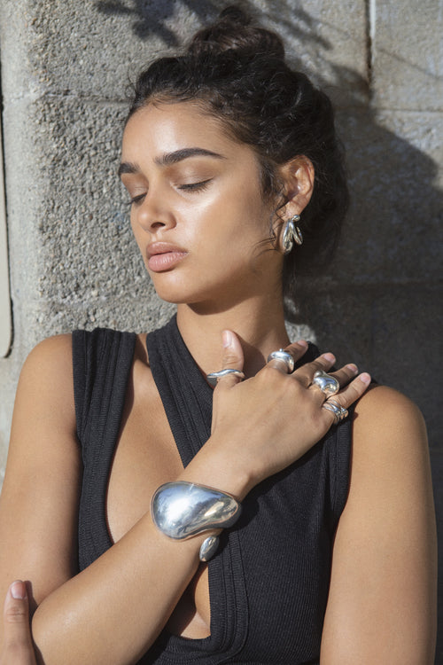 MOUNSER Corn Ring in sterling silver worn on model showing organic sculptural shape and mirror finish