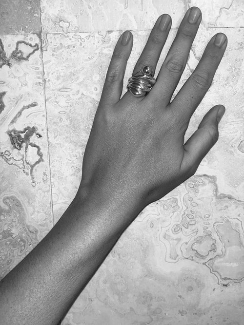 MOUNSER Corn Ring in sterling silver worn on hand showing organic sculptural shape and mirror finish