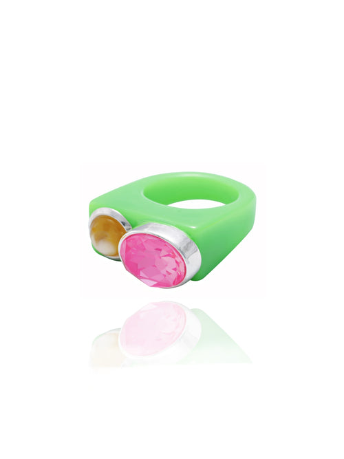 Angle view of MOUNSER Couplet Ring in Best Luck a jewel toned dual stone ring featuring a Swarovski rhinestone and natural gemstone cabochon on a lucite band
