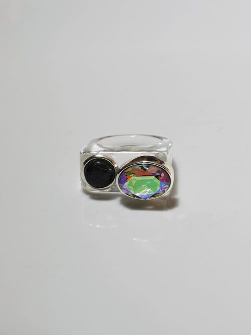 contrast shot of MOUNSER Couplet Ring in On Ice a jewel toned dual stone ring featuring a Swarovski rhinestone and natural gemstone cabochon on a lucite band.