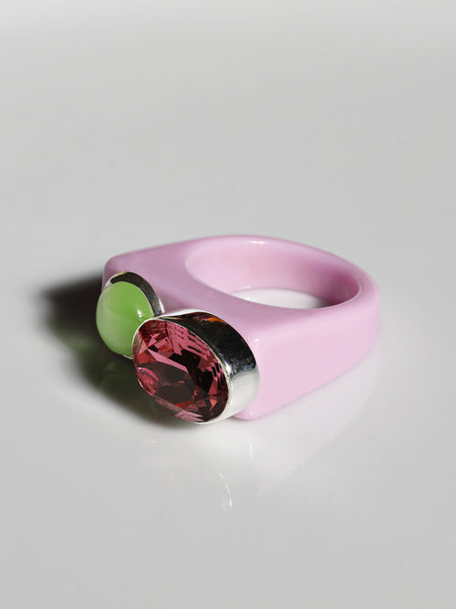 Angle view of MOUNSER Couplet Ring in Rose Water a jewel toned dual stone ring featuring a Swarovski rhinestone and natural gemstone cabochon on a lucite band