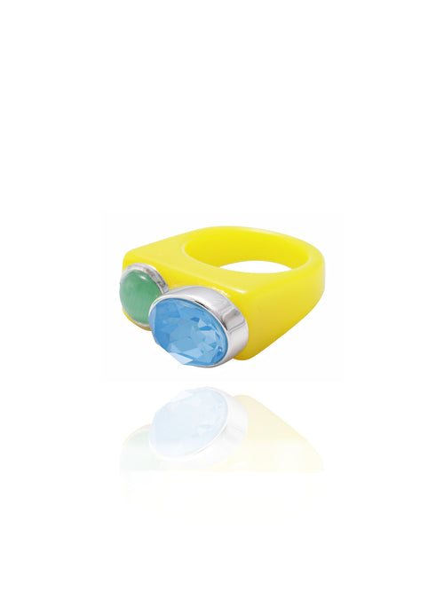 Angle view of MOUNSER Couplet Ring in Spirulina a jewel toned dual stone ring featuring a Swarovski rhinestone and natural gemstone cabochon on a lucite band