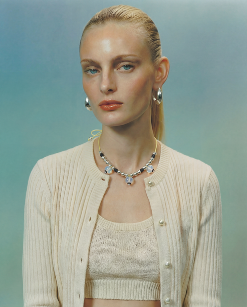 model shot of MOUNSER Crescent Hoops in Silver essential sculptural hoop earring