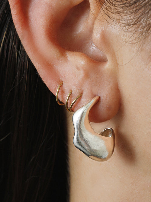 side shot of MOUNSER Cumulus Mis-Matched Earrings in Sterling Silver Sterling sculptural free form asymmetric earring pair