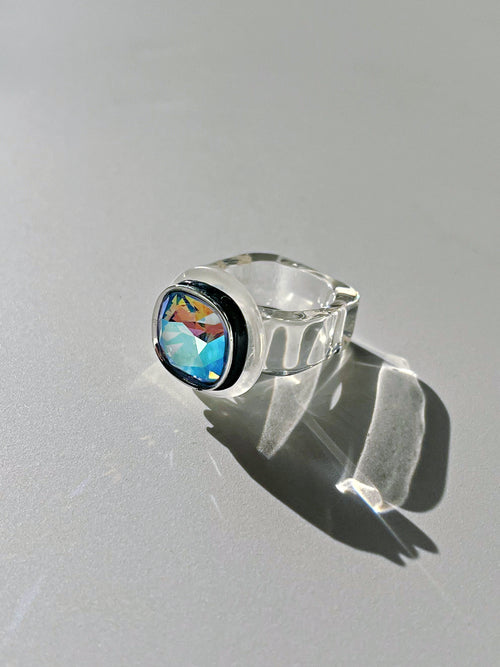 Side view contrast shot of MOUNSER Daydream Ring in Disco showing sculptural acrylic resin ring base and Swarovski crystal detail