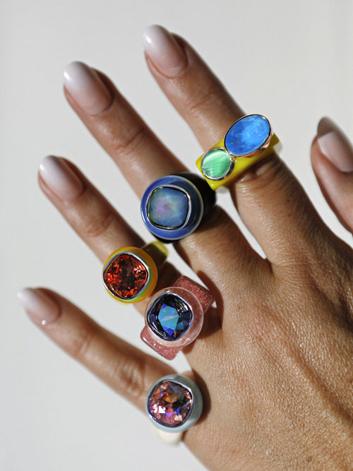 Close-up of MOUNSER Daydream Ring in Poppy showing vibrant Swarovski crystal and polished acrylic ring band
