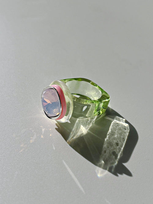 Side view contrast shot of MOUNSER Daydream Ring in Sweet Tart showing sculptural acrylic resin ring base and Swarovski crystal detail