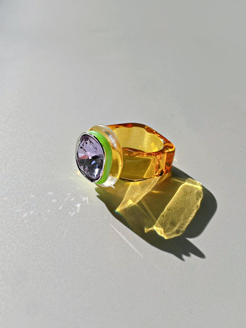 Side view contrast shot of MOUNSER Daydream Ring in Vista showing sculptural acrylic resin ring base and Swarovski crystal detail