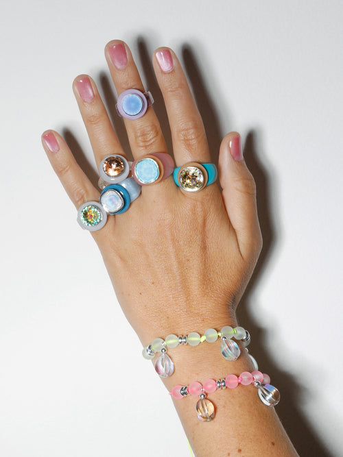 hand shot of MOUNSER Disco Pinky Ring in Cool Lilac featuring colorful acrylic resin and Swarovski crystal gemstone