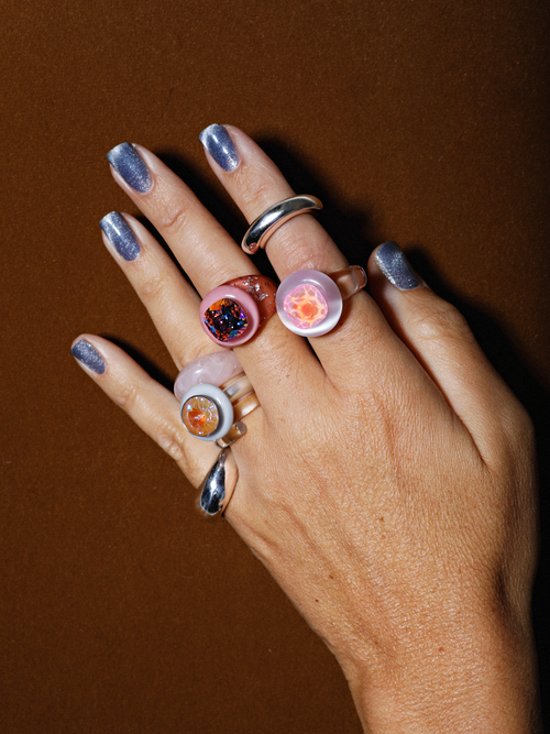 Close up of MOUNSER Electric Disco Ring Set in Fog Machine, a candy-colored sculptural set of 3 stacking statement rings