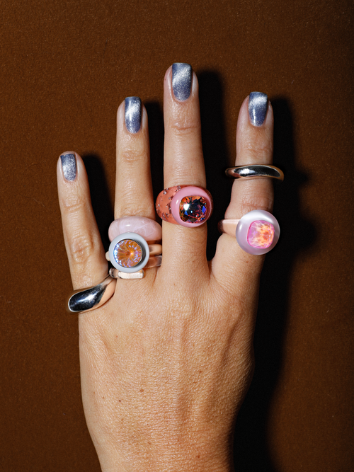 Studio shot of MOUNSER Electric Disco Ring Set in Fog Machine, a candy-colored sculptural set of 3 stacking statement rings