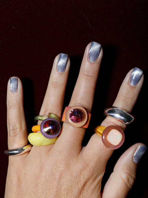 Close up of MOUNSER Electric Disco Ring Set in Solar Lilac, a candy-colored sculptural set of 3 stacking statement rings