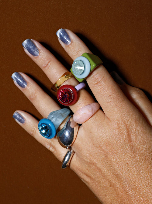 MOUNSER Electric Disco Ring Set in Twilight Plum, a candy-colored sculptural set of 3 stacking statement rings shot on hand