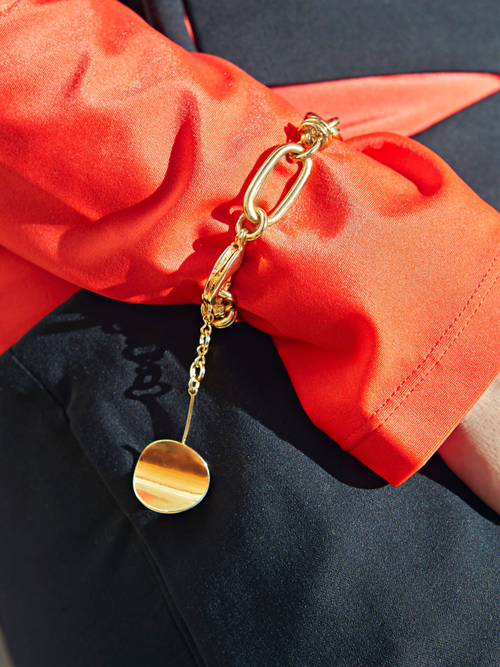 detail shot of MOUNSER Hops Bracelet in Gold a luminous 14k gold plated brass chunky chain with sculptural disc charm