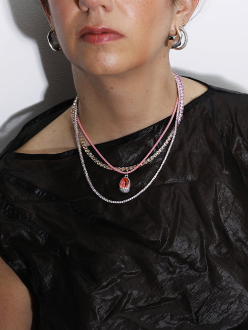Model wearing MOUNSER Laguna Matchstick Width Necklace in Pink colorful designer tennis necklace