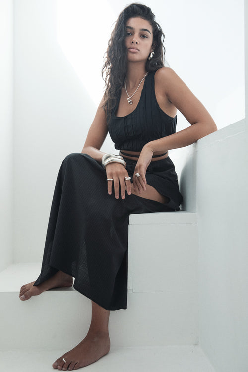 full body shot of MOUNSER Large Egg Earrings in Sterling Silver, handcrafted sculptural free form teadrop earrings in an egg shape.