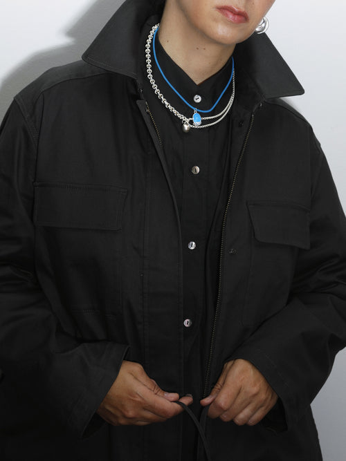 MOUNSER Nest Necklace in Belize sculptural designer cord pendant necklace on model