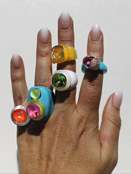 close up of MOUNSER Nest Ring in 1986 featuring a brilliant Swarovski crystal, pavé rhinestone detailing and colorful acrylic resin ring band.