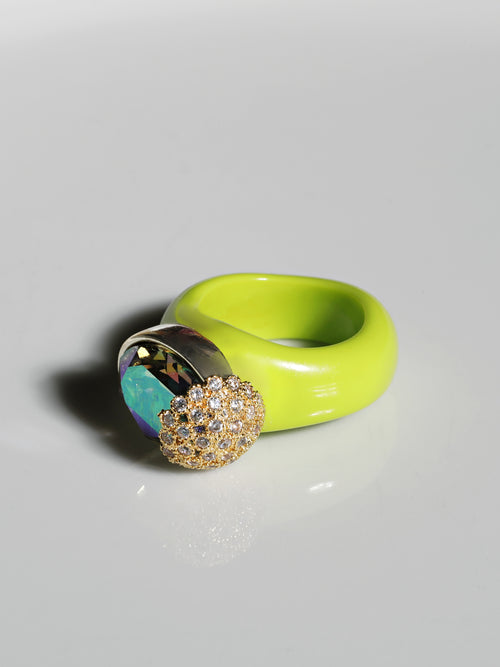 angle shot of MOUNSER Nest Ring in Key Lime featuring a brilliant Swarovski crystal, pavé rhinestone detailing and colorful acrylic resin ring band.