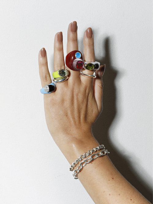 model shot of MOUNSER Nest Ring in Key Lime featuring a brilliant Swarovski crystal, pavé rhinestone detailing and colorful acrylic resin ring band.