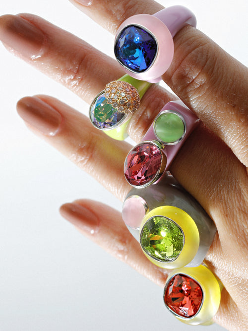 detail shot of MOUNSER Nest Ring in Key Lime featuring a brilliant Swarovski crystal, pavé rhinestone detailing and colorful acrylic resin ring band.