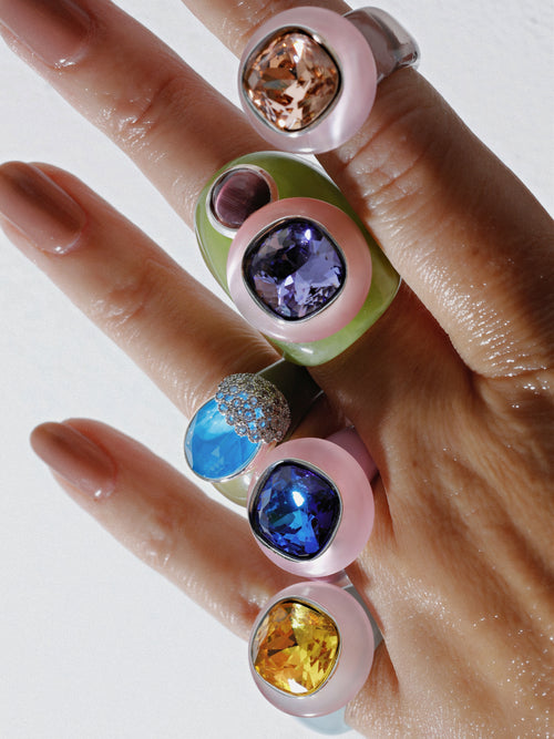 detail shot of MOUNSER Nest Ring in Mirage featuring a brilliant Swarovski crystal, pavé rhinestone detailing and colorful acrylic resin ring band.