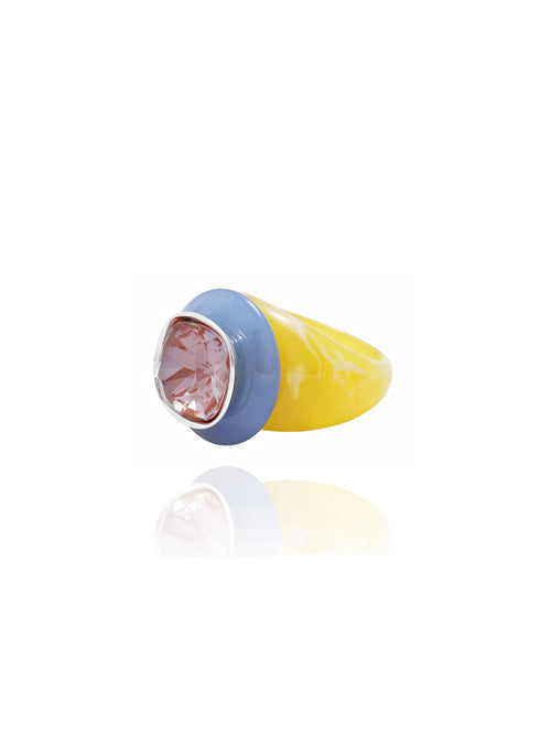 angle shot of MOUNSER Objects Found Ring in Terazzo featuring glossy, polished natural gemstone, and Swarovski crystal on an acrylic ring base