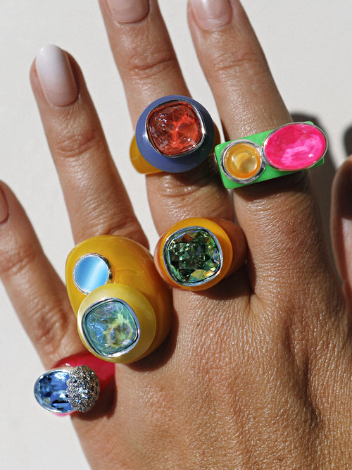 model shot of MOUNSER Objects Found Ring in Terazzo featuring glossy, polished natural gemstone, and Swarovski crystal on an acrylic ring base
