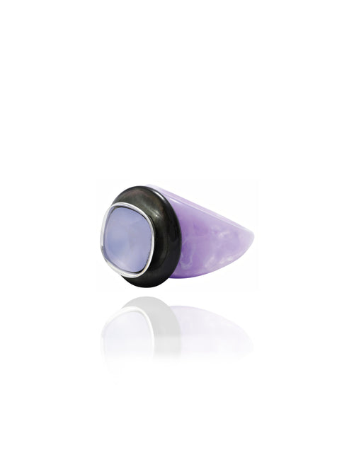 angle shot of MOUNSER Objects Found Ring in Ube featuring glossy, polished natural gemstone, and Swarovski crystal on an acrylic ring base