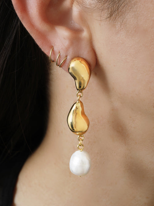 detail shot of MOUNSER Oceanus Earrings in Gold sculptural gold drop earrings with freshwater pearl accents 