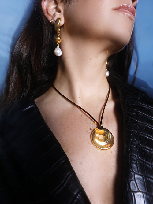model shot of MOUNSER Oceanus Earrings in Gold sculptural gold drop earrings with freshwater pearl accents 