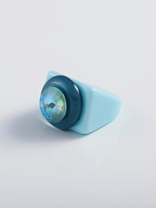 Side view shot of MOUNSER Raw Gradient Block Ring in Acid Wash featuring a colorful Swarovski crystal on an acrylic resin band