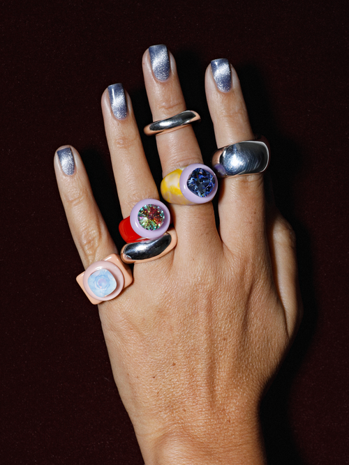 Studio detail shot of MOUNSER Raw Gradient Block Ring in Baby Tee featuring a colorful Swarovski crystal on an acrylic resin band