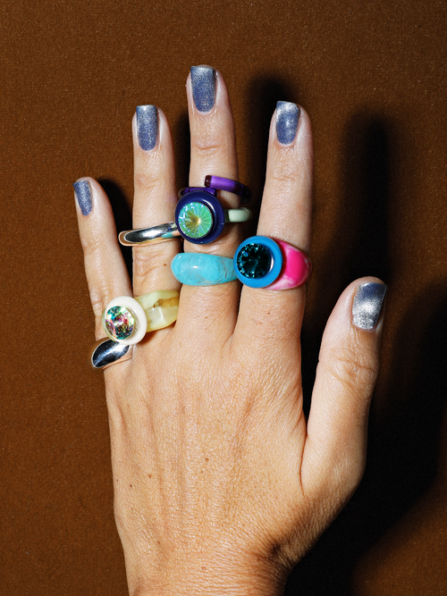 Studio shot on model of MOUNSER Raw Gradient Psychedelia Ring in Aqua Nocturne featuring a cushion-cut Austrian crystal and colorful acrylic resin band in tie-dyed effect