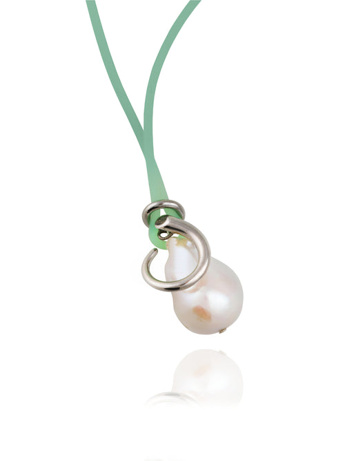 Close up detail shot of MOUNSER Seaside Souvenir Necklace in Corsica showing sculptural freshwater pearl pendant cord necklace