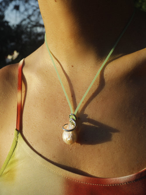 Close detail of MOUNSER Seaside Souvenir Necklace in Corsica showing sculptural freshwater pearl pendant