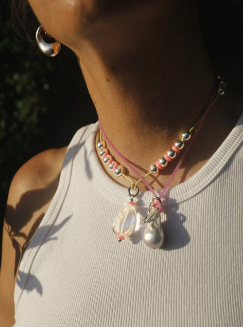 close up shot of MOUNSER Seaside Souvenir Necklace in Ibiza colorful glass beaded cord choker necklace 