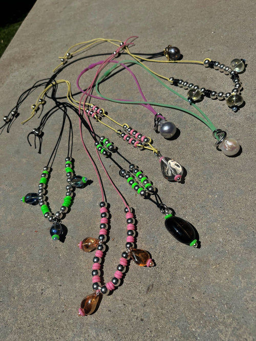 collection shot of MOUNSER Seaside Souvenir Necklace in Menorca colorful glass beaded cord choker necklace 
