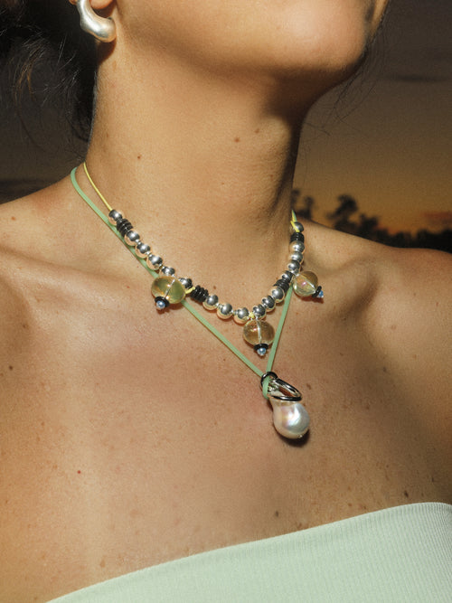 detail shot of MOUNSER Seaside Souvenir Necklace in Capri colorful glass beaded cord choker necklace 