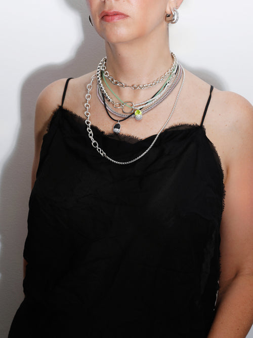 model shot of Sister Chain Necklace in sterling silver by MOUNSER featuring asymmetrical layered silhouette and convertible extender detail