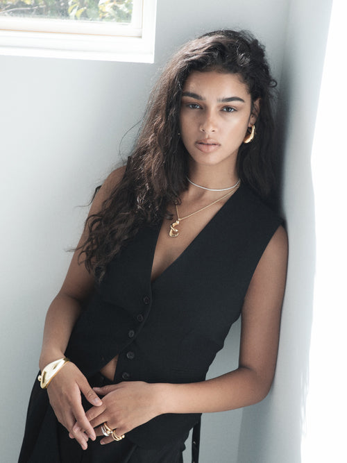 studio shot of MOUNSER Small Buck Cuff Bracelet in Sterling Silver and Gold Vermeil free form organic shaped statement cuff with mirror finish