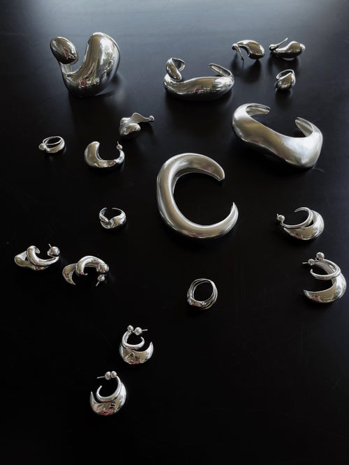 collection shot of MOUNSER Small Buck Cuff Bracelet in Sterling Silver sculptural statement cuff bracelet with a puffed voluminous shape and a high polished glossy finish