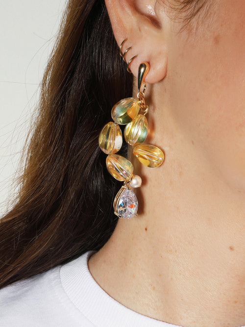 close up shot of MOUNSER Soap Earrings in Bubble Yellow designer sculptural glass asymmetric statement earrings.