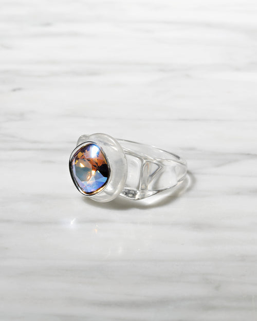 angle shot of MOUNSER Spectrum Ring in H2O featuring a richly colored acrylic ring band with a sparkling colorful Swarovski crystal.