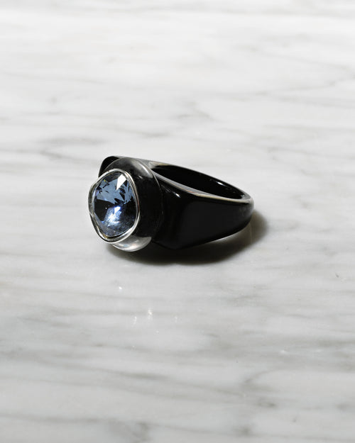 angle shot of MOUNSER Spectrum Ring in Nox featuring a richly colored acrylic ring band with a sparkling colorful Swarovski crystal.